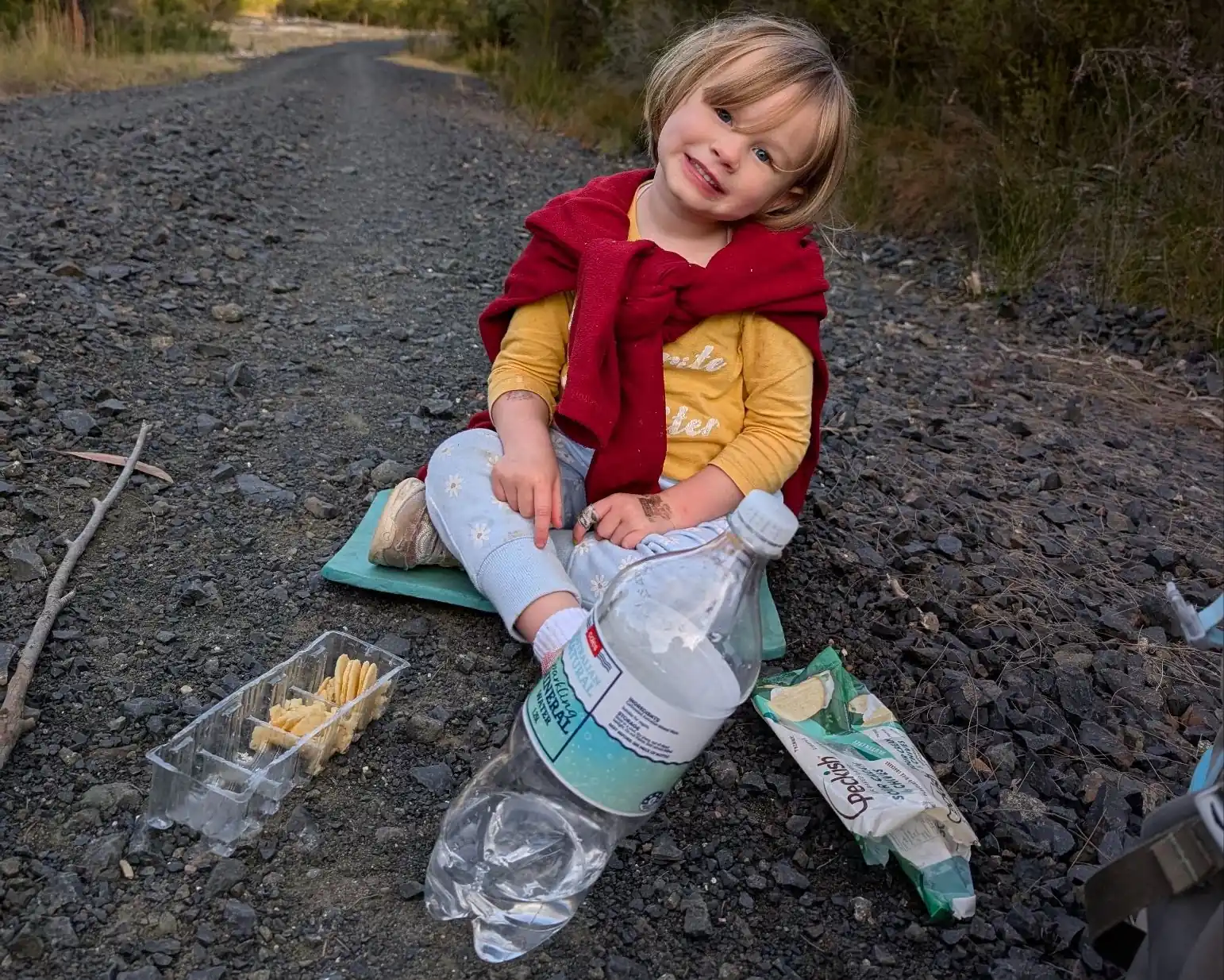 kid with snacks on a hike